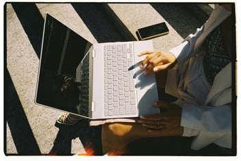 Person typing on laptop