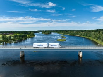 Kaukokiito trucks crossing bridge