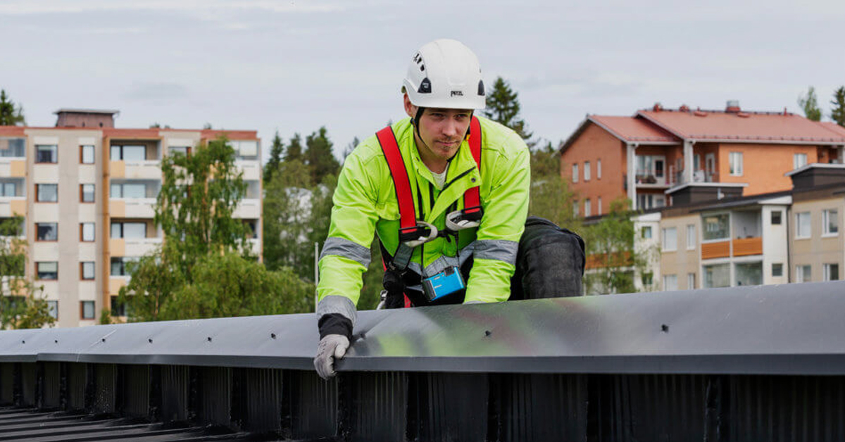 Worker inspecting roof