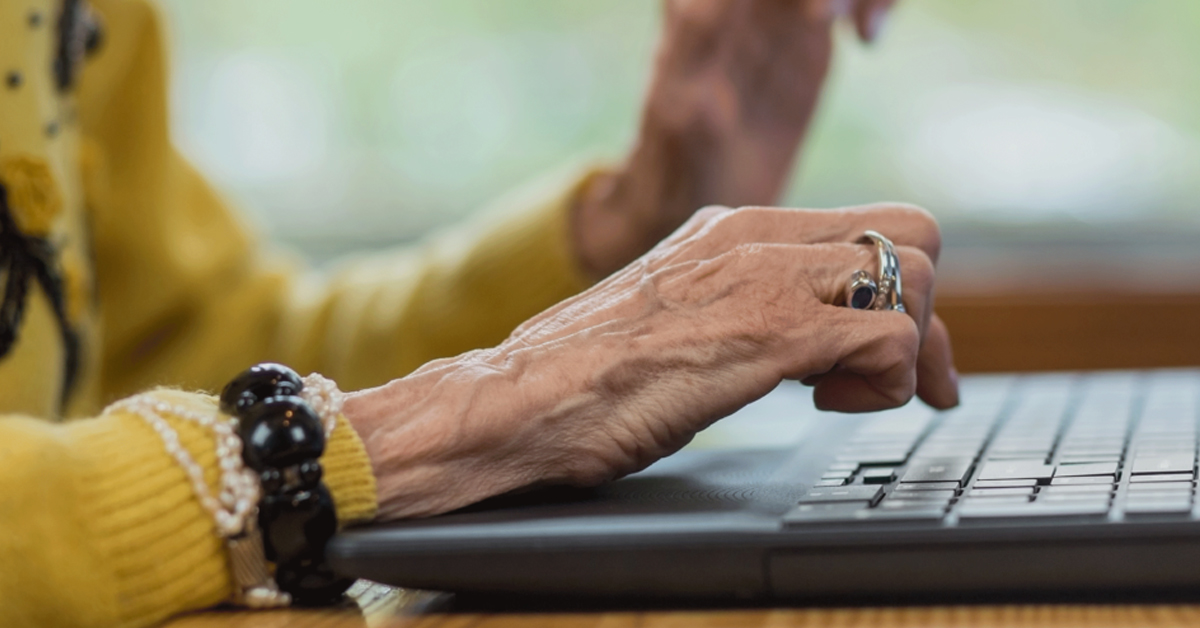 Person typing on laptop