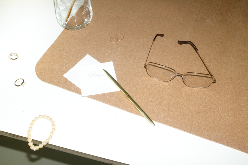 Table with glasses, pen and notes