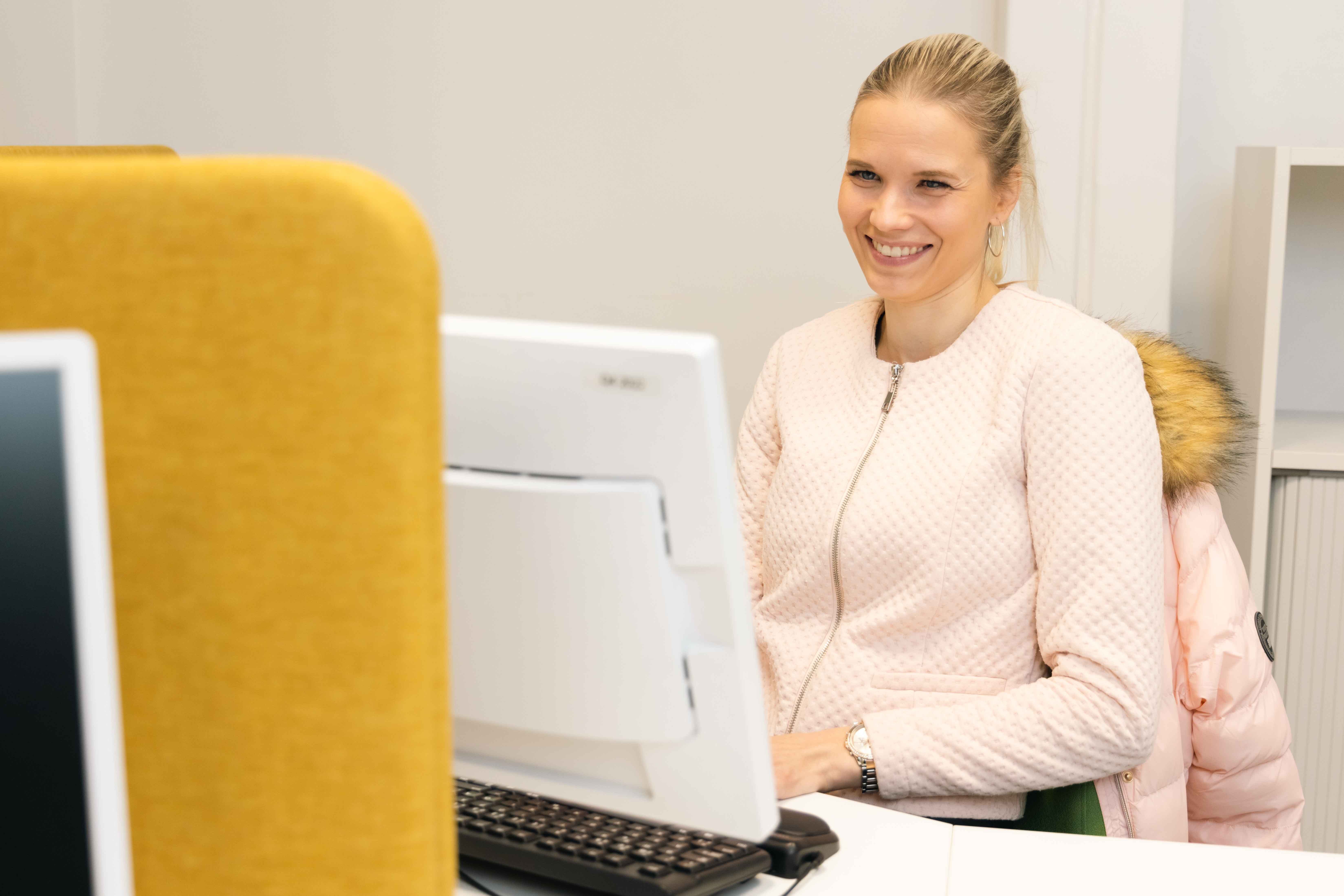 Certia employee working at her desk