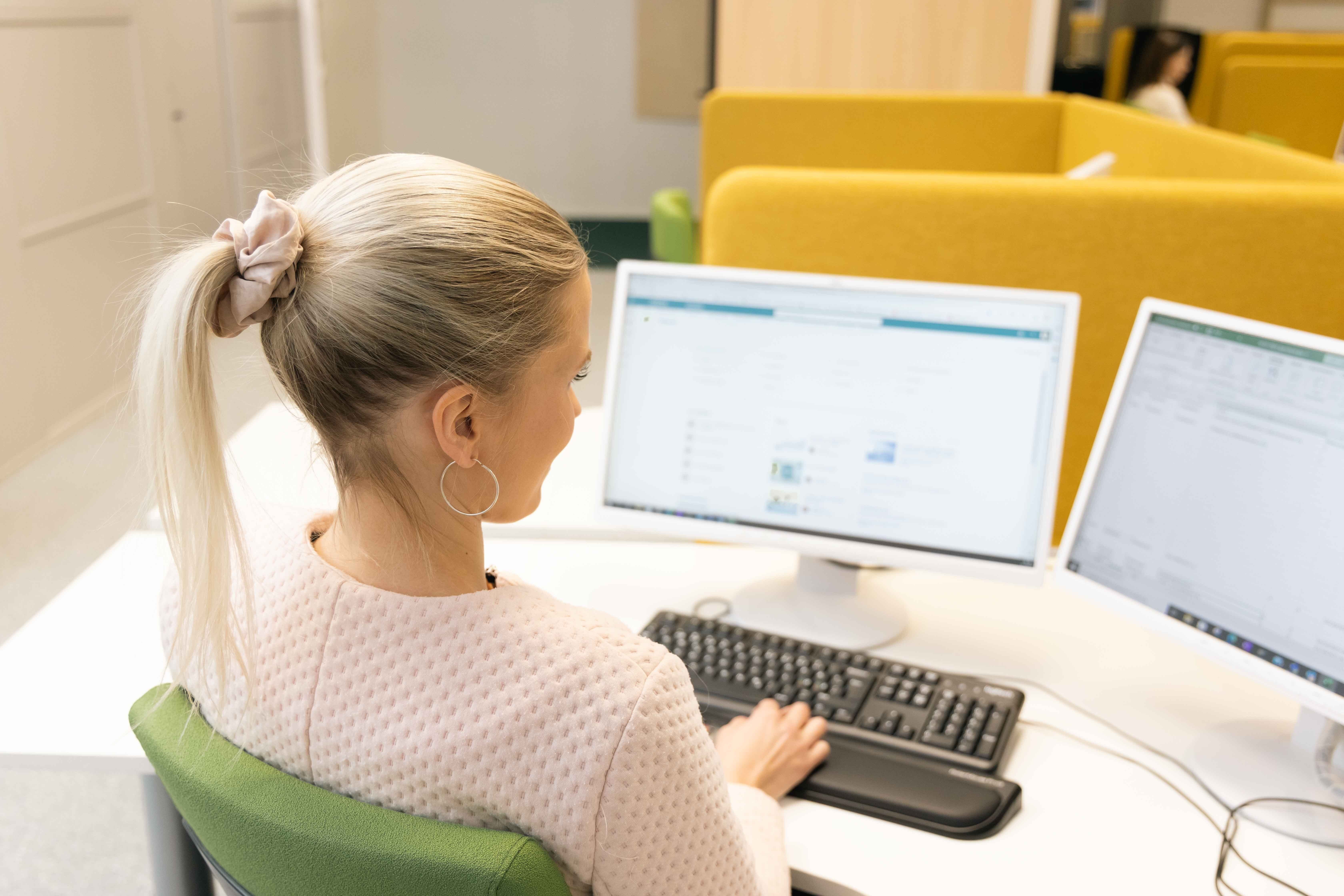 Certia employee working at her desk