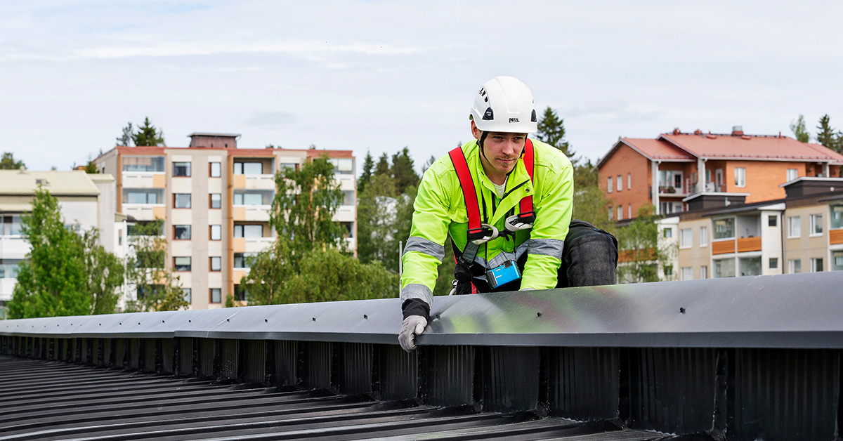 Worker fixing roof