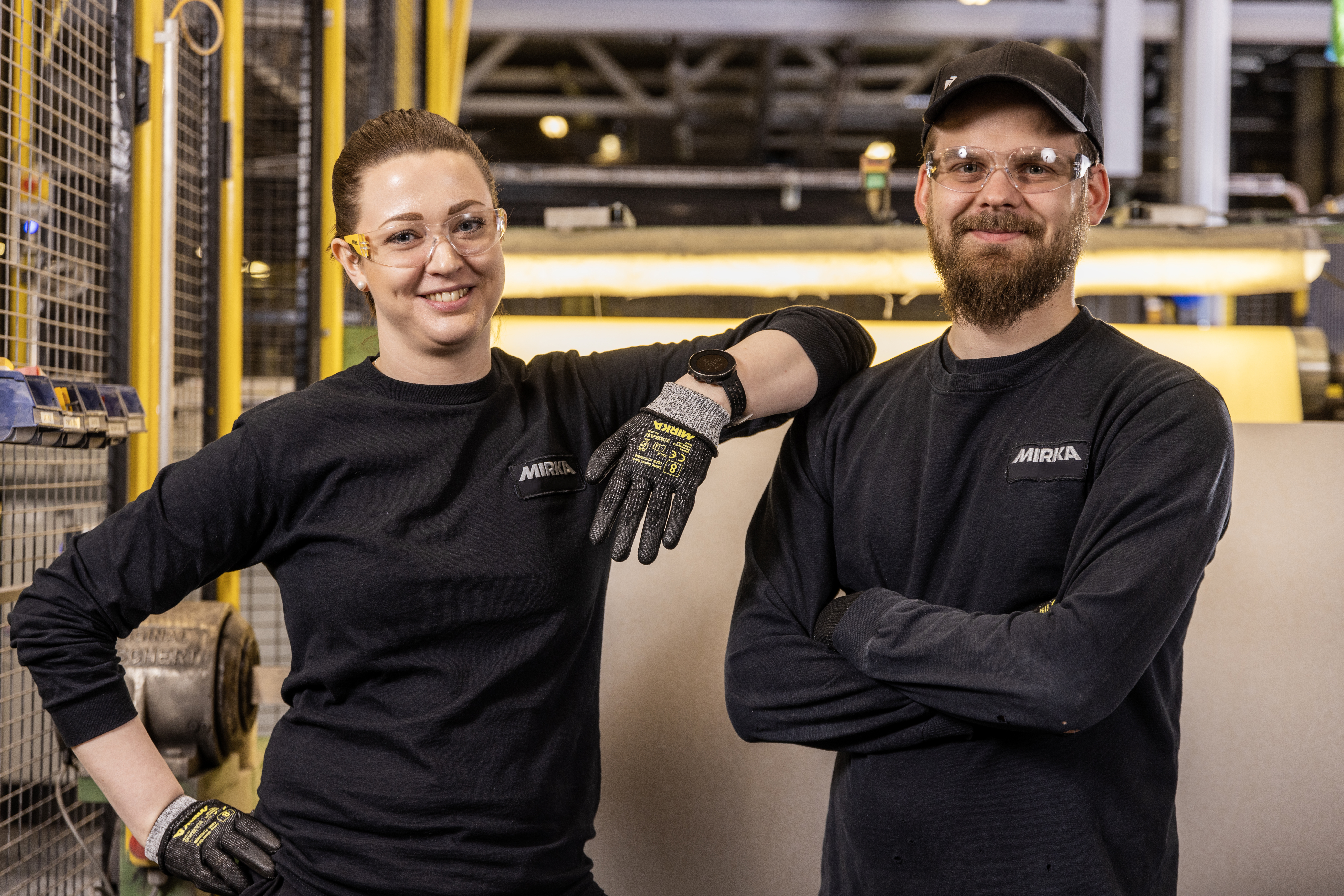 Two Mirka workers at a factory