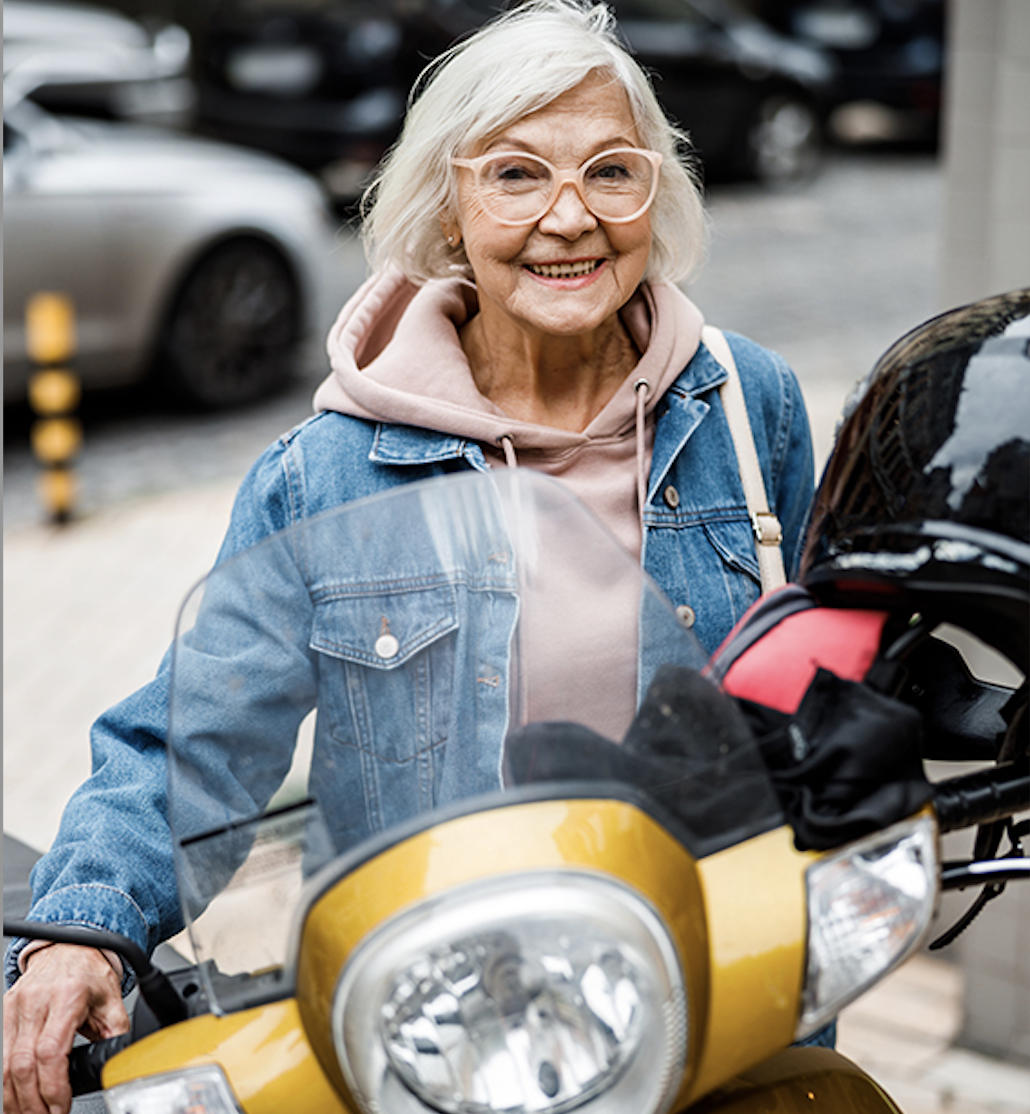 Person next to a scooter