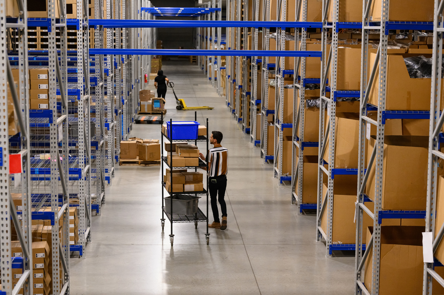 Person handling boxes at warehouse